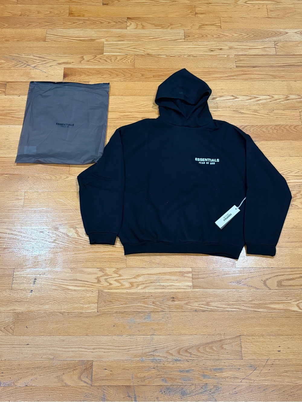 ESSENTIALS Black Pullover Hoodie with White Chest Logo